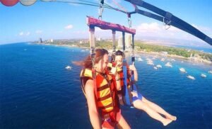 Foreigners Doing Parasailing in Mactan Cebu